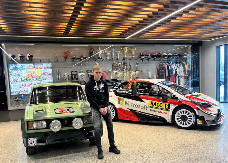Ott Tänak with Vello Õunpuu's Lada VFTS and the winning Toyota Yaris WRC in his garage